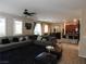 Spacious living room featuring a large sectional sofa and open floor plan at 647 Wounded Star Ave, Las Vegas, NV 89178