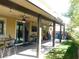 Covered patio with ceiling fan and outdoor seating at 647 Wounded Star Ave, Las Vegas, NV 89178