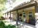 Covered patio with ceiling fan and outdoor seating at 647 Wounded Star Ave, Las Vegas, NV 89178