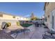 Spacious backyard with patio, fire pit, and artificial turf at 734 Holland Heights Ave, Las Vegas, NV 89123