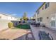 Backyard with patio, fire pit, and artificial turf at 734 Holland Heights Ave, Las Vegas, NV 89123