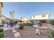 Backyard with patio, fire pit, and artificial turf at 734 Holland Heights Ave, Las Vegas, NV 89123