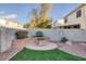 Backyard with fire pit and artificial turf at 734 Holland Heights Ave, Las Vegas, NV 89123