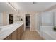 Elegant bathroom with double vanity, walk-in shower, and bathtub at 734 Holland Heights Ave, Las Vegas, NV 89123