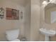 Small bathroom with pedestal sink and decorative art at 734 Holland Heights Ave, Las Vegas, NV 89123