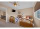 Charming bedroom with two twin beds, a TV, and plenty of natural light at 734 Holland Heights Ave, Las Vegas, NV 89123