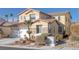 Two-story house with a white garage door and landscaping at 734 Holland Heights Ave, Las Vegas, NV 89123