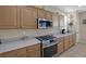 Kitchen with stainless steel appliances and light wood cabinets at 734 Holland Heights Ave, Las Vegas, NV 89123