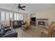 Relaxing living room with leather sofas, fireplace, and large TV at 734 Holland Heights Ave, Las Vegas, NV 89123