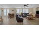 Living room with leather furniture and tile floors at 734 Holland Heights Ave, Las Vegas, NV 89123