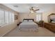 Main bedroom with ceiling fan and wood dresser at 734 Holland Heights Ave, Las Vegas, NV 89123