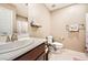 Clean bathroom with single sink vanity, toilet, and shower at 7915 Formitch Ct, Las Vegas, NV 89166