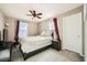 Bedroom with queen-size bed and red curtains at 7915 Formitch Ct, Las Vegas, NV 89166