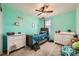 bedroom with twin bed and mint green walls at 7915 Formitch Ct, Las Vegas, NV 89166