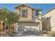 Two-story home with stone facade and two-car garage at 7915 Formitch Ct, Las Vegas, NV 89166