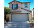 Two-story house with stone accents and a two-car garage at 7915 Formitch Ct, Las Vegas, NV 89166