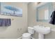 Small bathroom with pedestal sink and toilet at 8255 One Las Vegas Blvd # 504, Las Vegas, NV 89123