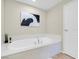 Bathroom featuring a large soaking tub and modern art at 8255 One Las Vegas Blvd # 504, Las Vegas, NV 89123