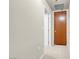 Hallway with wood door and neutral colored walls at 8255 One Las Vegas Blvd # 504, Las Vegas, NV 89123