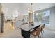 Open concept kitchen and dining area with island and modern design at 10981 Laureldale Ct, Las Vegas, NV 89141