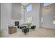 Two-story living room with hardwood floors, a fireplace, and high ceilings at 10981 Laureldale Ct, Las Vegas, NV 89141