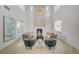 Spacious living room with high ceilings, a fireplace, and herringbone wood floors at 10981 Laureldale Ct, Las Vegas, NV 89141