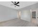 A simple bedroom design with neutral walls, a ceiling fan, and a closet with sliding doors at 11119 Cantoria Ct, Las Vegas, NV 89141