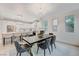 Dining area leading to the bright kitchen features modern decor and stylish accents at 11119 Cantoria Ct, Las Vegas, NV 89141