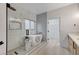 Modern main bathroom features a soaking tub, walk-in shower, and dual vanity at 11119 Cantoria Ct, Las Vegas, NV 89141