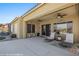 Covered patio with fans, and lounge chairs overlooks the pool area for relaxing days and evenings at 1143 Tortoise Mountain Dr, Mesquite, NV 89034