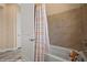 Clean bathroom featuring a neutral tub and shower with coordinating tile surround at 1143 Tortoise Mountain Dr, Mesquite, NV 89034