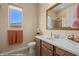 Bright bathroom with a single sink vanity, framed mirror and walk-in shower at 1143 Tortoise Mountain Dr, Mesquite, NV 89034