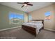 Bright bedroom features a large window and a comfortable bed with views of the backyard at 1143 Tortoise Mountain Dr, Mesquite, NV 89034