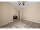 Spacious bedroom with light gray wood-look floors, ceiling fan, and ample natural light at 1143 Tortoise Mountain Dr, Mesquite, NV 89034