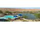 Aerial view of the community pool with mountain views and lush landscape at 1143 Tortoise Mountain Dr, Mesquite, NV 89034