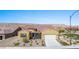 Charming single-story home featuring a tile roof, desert landscaping, and a two-car garage at 1143 Tortoise Mountain Dr, Mesquite, NV 89034