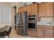 A lovely kitchen featuring stainless steel appliances and neutral countertops with plenty of cabinet space at 1143 Tortoise Mountain Dr, Mesquite, NV 89034