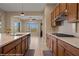 Lovely kitchen with light countertops, stainless steel appliances, and warm wood cabinetry at 1143 Tortoise Mountain Dr, Mesquite, NV 89034