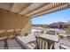 Charming covered patio with a fire pit table, perfect for enjoying evenings outdoors at 1143 Tortoise Mountain Dr, Mesquite, NV 89034