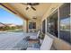 Relaxing covered patio with ceiling fans, sliding glass doors, and lounge chairs for outdoor living at 1143 Tortoise Mountain Dr, Mesquite, NV 89034