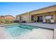 Inviting backyard pool and patio, perfect for outdoor relaxation and entertaining with desert views at 1143 Tortoise Mountain Dr, Mesquite, NV 89034