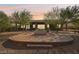 Round patio with fire pit and seating area at 248 N Milan St, Henderson, NV 89015