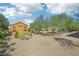 Landscaped backyard with shed and trees at 248 N Milan St, Henderson, NV 89015