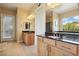 Elegant bathroom with double sinks, and a large shower at 248 N Milan St, Henderson, NV 89015