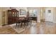 Bright dining room featuring hardwood floors, a large table, and a built-in hutch at 248 N Milan St, Henderson, NV 89015