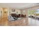 Bright and airy living room with hardwood floors and fireplace at 248 N Milan St, Henderson, NV 89015