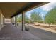 Covered patio overlooking a spacious backyard at 248 N Milan St, Henderson, NV 89015