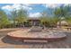 Large brick patio with fire pit and seating area at 248 N Milan St, Henderson, NV 89015