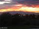 Stunning sunset view overlooking city lights and mountain range at 248 N Milan St, Henderson, NV 89015