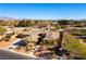 Aerial view of a house with a tile roof, driveway, and landscaping at 5024 Crown Cypress St, Las Vegas, NV 89149